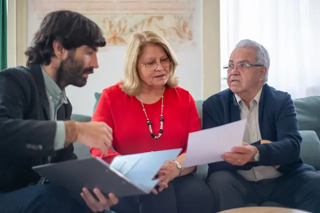 An adviser walking a couple through their paperwork